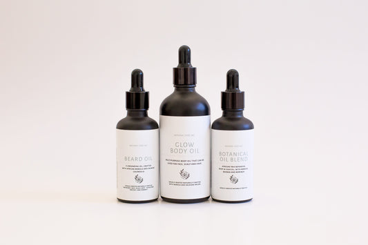 Manna and Me African Trio Body Oil bottle, deeply nourishing botanical body treatment for glowing skin.