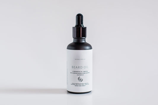 Manna and Me natural Beard Oil amber glass bottle with dropper, soothing anti-itch conditioning treatment for men.