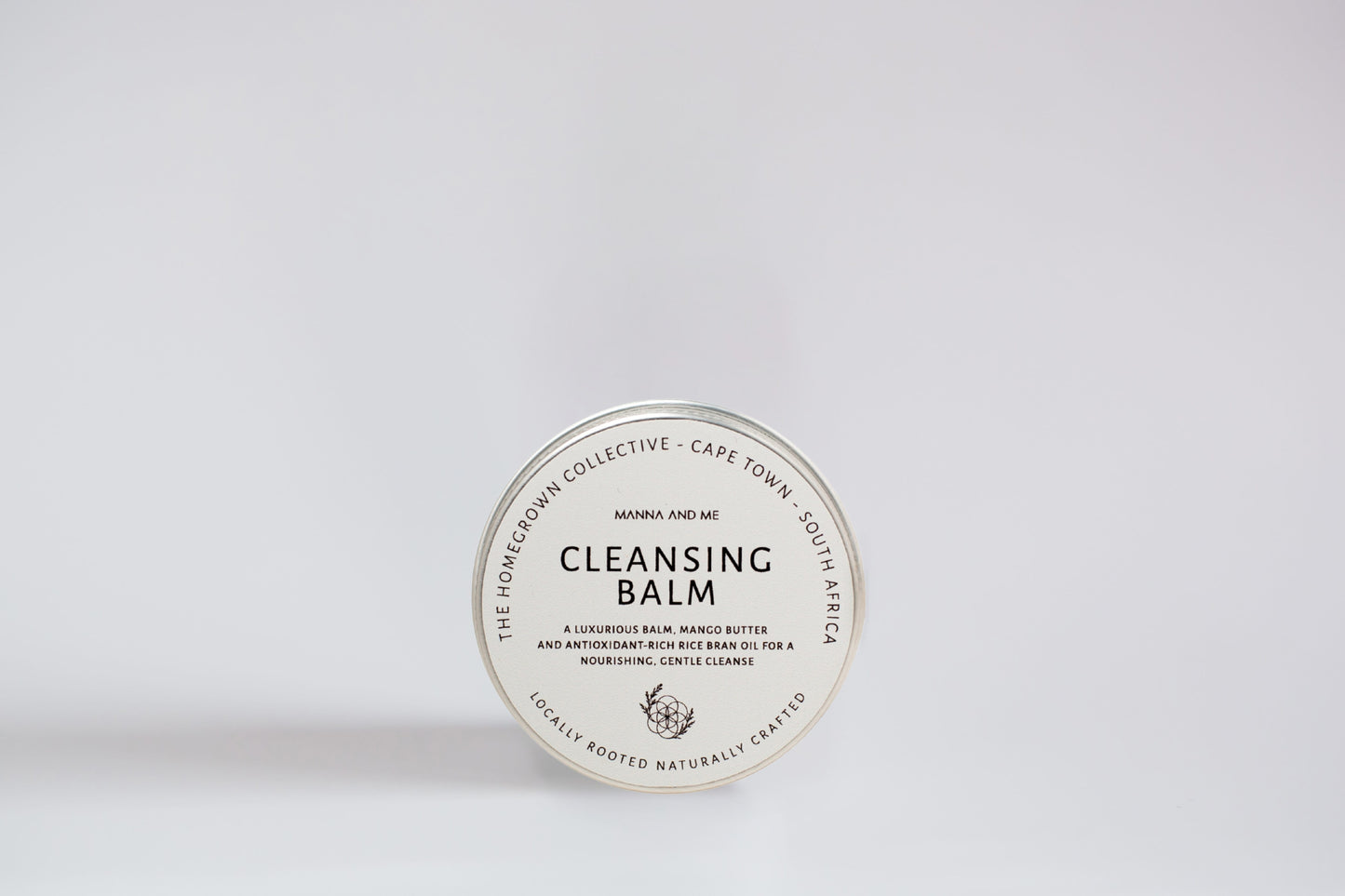 Manna and Me Cleansing Balm and Face Mask jar, soothing botanical oil-to-milk daily cleanser.