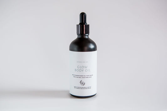 Manna and Me Glow Body Oil bottle, luxurious radiant skin hydration infused with botanical botanical extracts.