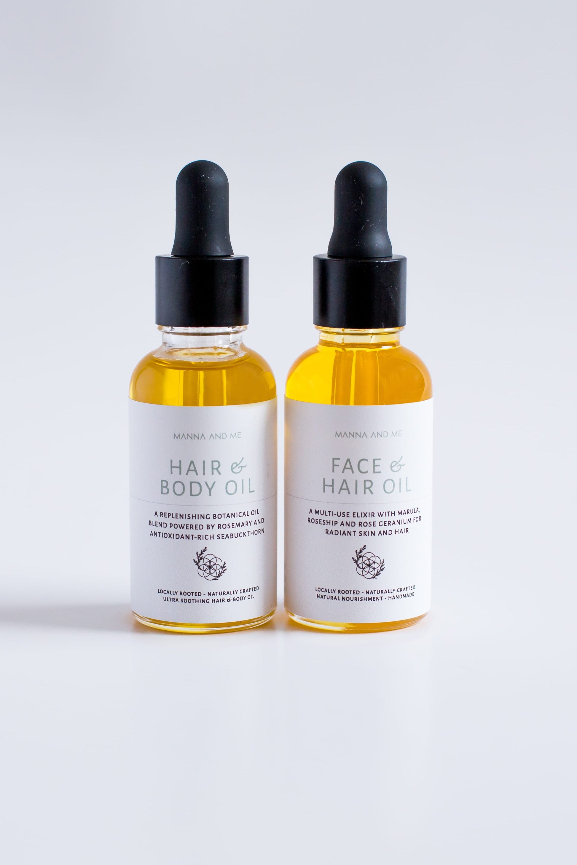 Manna and Me multi-use Hair and Body Oil glass bottle with natural botanical plant oils.