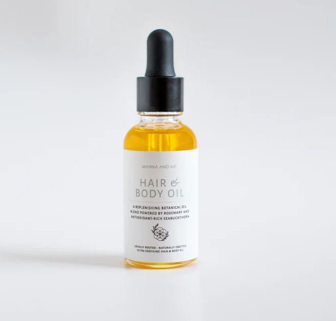 Manna and Me multi-use Hair and Body Oil glass bottle with natural botanical plant oils.