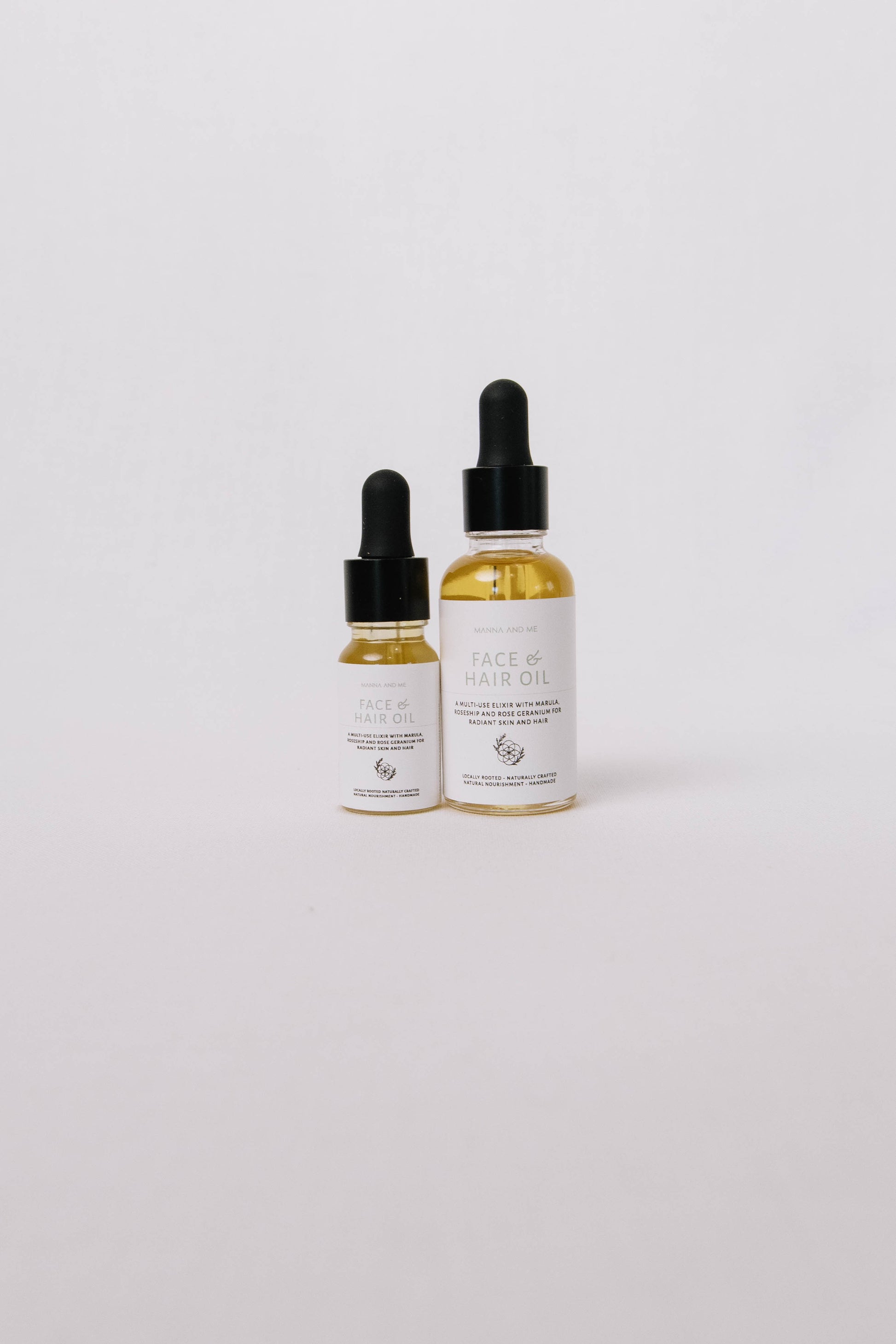 Manna and Me concentrated Face & Hair Oil dropper bottle, restorative South African botanical blend.