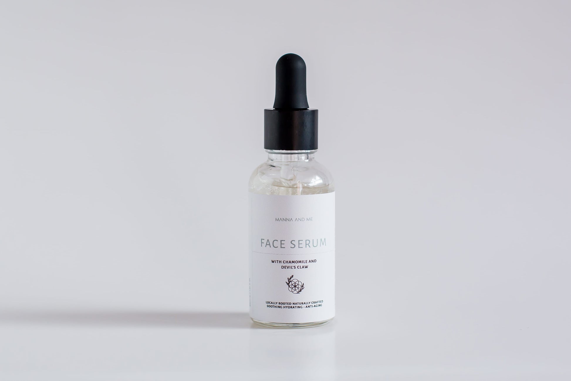 Manna and Me Fortify Skin Serum amber glass bottle with dropper, concentrated botanical formula for barrier repair.